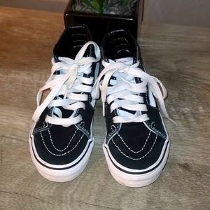 Black and white high top Vans